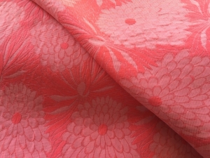 Jacquard---Dirndlstoff--beidseitig-verwendbar-gewebt---knitterarm---koralle----50-cm